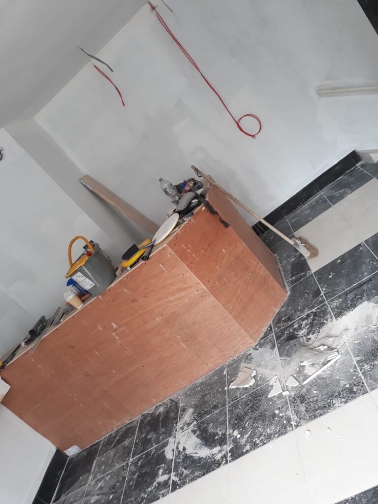 Commercial joinery bespoke reception desk installation in a modern Doncaster office.